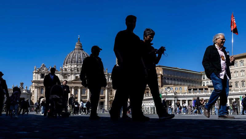 A group of pilgrims walk through St. Peter's Square at the Vatican on their way to the Holy Door of St. Peter's Basilica April 2, 2025. Pope Francis is convalescing and not able to meet the pilgrims. (CNS photo/Pablo Esparza)