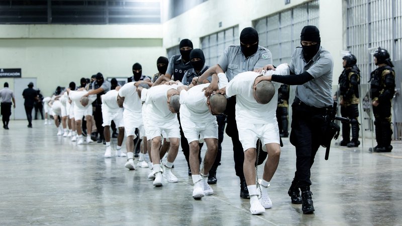 Salvadoran police officers escort an alleged member of the Venezuelan gang Tren de Aragua in Tecoluca, El Salvador, March 16, 2025, who were recently deported by the U.S. government to be imprisoned in the Terrorism Confinement Center (CECOT) prison, as part of an agreement with the Salvadoran government. (OSV News photo/Secretaria de Prensa de la Presidencia/Handout via Reuters)