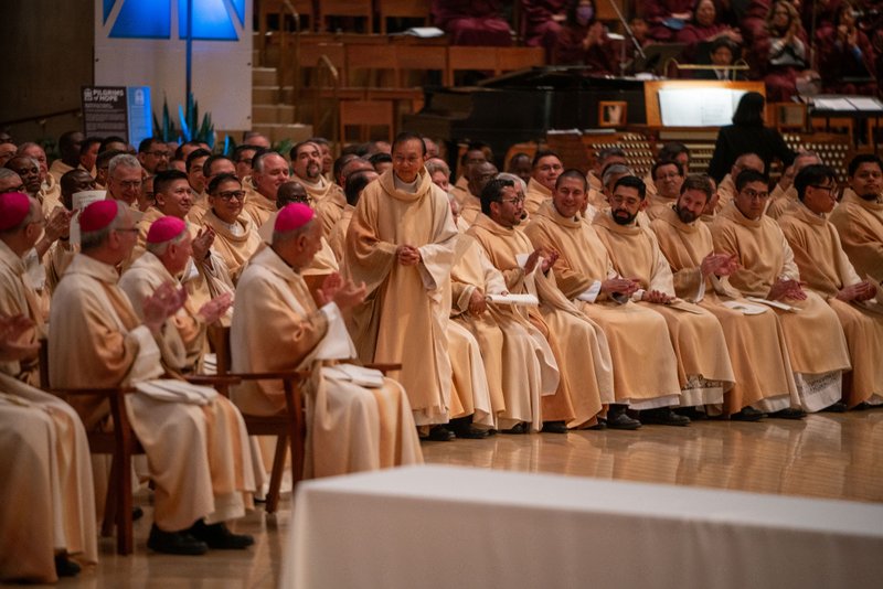 Father Ramon Valera is recognized as one of the priests celebrating jubilarian anniversaries of 50 years in the priesthood during the Chrism Mass at the Cathedral of Our Lady of the Angels on April 14. (John Rueda)