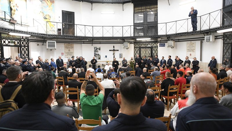 Pope Francis speaks to inmates during a Holy Thursday visit to Rome's Regina Coeli jail April 17, 2025. (CNS photo/Vatican Media)