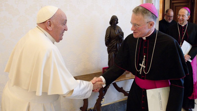 Pope Francis greets Archbishop Timothy P. Broglio, president of the U.S. Conference of Catholic Bishops and head of the U.S. Archdiocese for the Military Services, in the library of the Apostolic Palace at the Vatican April 18, 2024. Pope Francis, formerly Argentine Cardinal Jorge Mario Bergoglio, died April 21, 2025, at age 88. (CNS photo/Vatican Media)