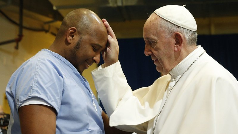 Pope Francis blesses a prisoner as he visits he Curran-Fromhold Correctional Facility in Philadelphia in this Sept. 27, 2015, file photo. Pope Francis, formerly Argentine Cardinal Jorge Mario Bergoglio, died April 21, 2025, at age 88. (CNS photo/Paul Haring)
