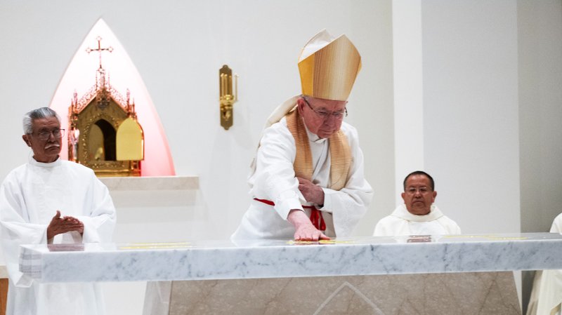 Archbishop José H. Gomez blesses the altar at the new Guardian Angels Church in Pacoima during the dedication Mass on April 4. (Victor Alemán)