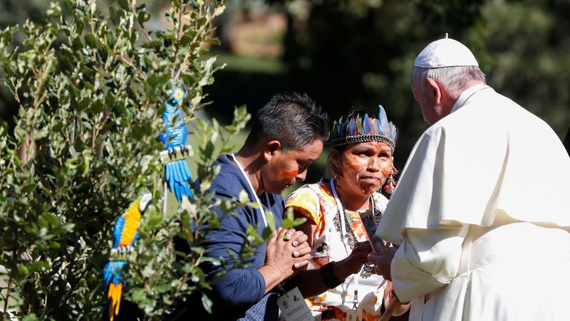 Pope Francis greets members of an indigenous community of the Amazon during a celebration and tree planting marking the feast of St. Francis in the Vatican Gardens Oct. 4, 2019. (CNS/Yara Nardi, Reuters)