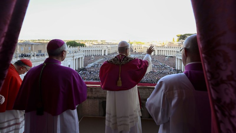 Pope Leo XIV, the former Cardinal Robert F. Prevost, waves to the crowds in St. Peter's Square at the Vatican after his election as pope May 8, 2025. (CNS photo/Vatican Media)