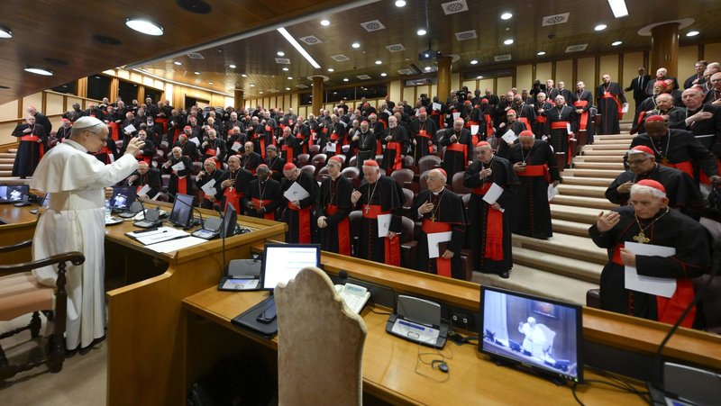 Pope Leo XIV prays with the College of Cardinals in the New Synod Hall at the Vatican May 10, 2025, during his first formal address to the college since his election May 8. (CNS photo/Vatican Media)