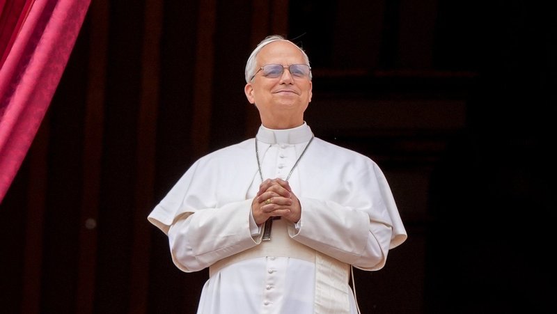 Pope Leo XIV looks out to the crowd from the central balcony of St. Peter's Basilica at the Vatican as he leads the midday recitation of the "Regina Coeli" prayer for the first time May 11, 2025. (CNS/Lola Gomez)