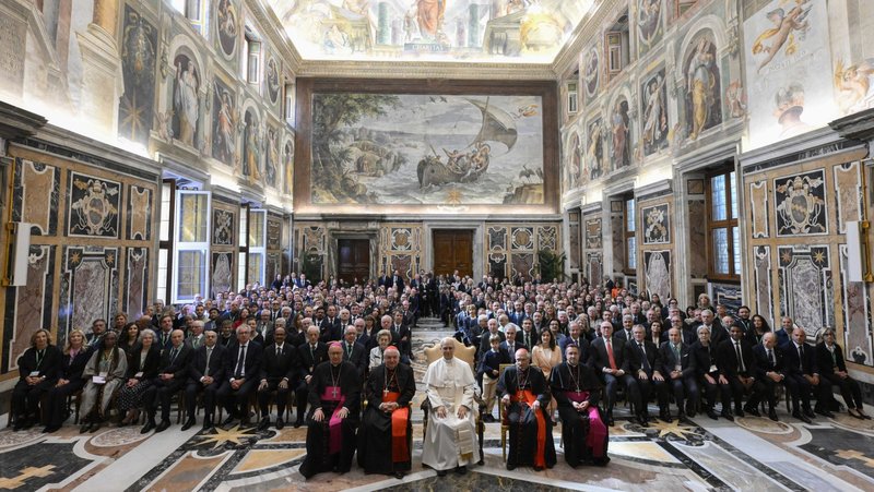 Pope Leo XIV poses for a photo with members of the Centesimus Annus Foundation in the Clementine Hall of the Apostolic Palace at the Vatican May 17, 2025. The pope is seated between French Cardinal Jean-Marc Aveline of Marseille, left, and Cardinal Silvano Tomasi, a retired Vatican diplomat. (CNS photo/Vatican Media)