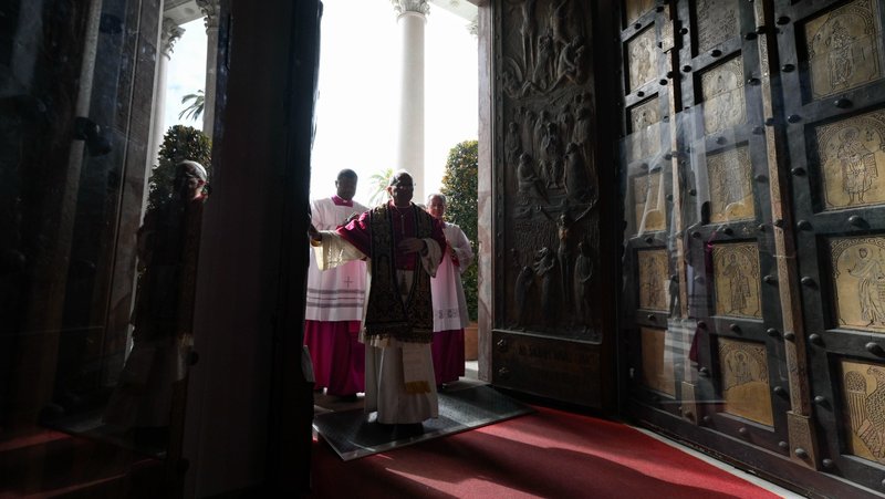 Pope Leo XIV crosses the Holy Door as he arrives for a visit to the Basilica of St. Paul Outside the Walls in Rome May 20, 2025. (CNS photo/Vatican Media)