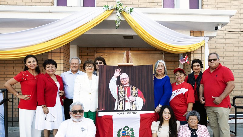Laura Gonzales, second from left, poses with other Peruvians at St. Joseph the Worker Church in Winnetka to celebrate Pope Leo XIV’s election. (Victor Alemán)