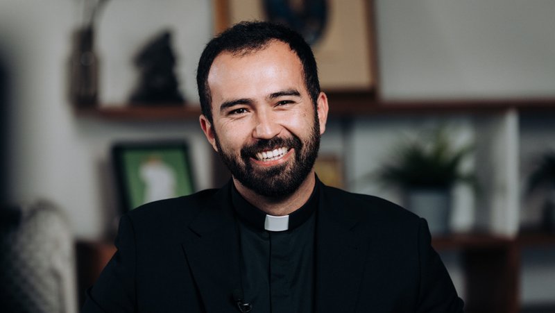 Christian Morquecho, a new priest ordained on May 31, sits during a video interview on April 8. (Isabel Cacho)