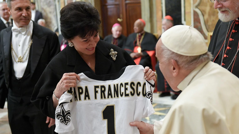 A member of the Papal Foundation greets Pope Francis with a personalized New Orleans Saints jersey, Friday, April 12, 2024. (CNA/Vatican Media)