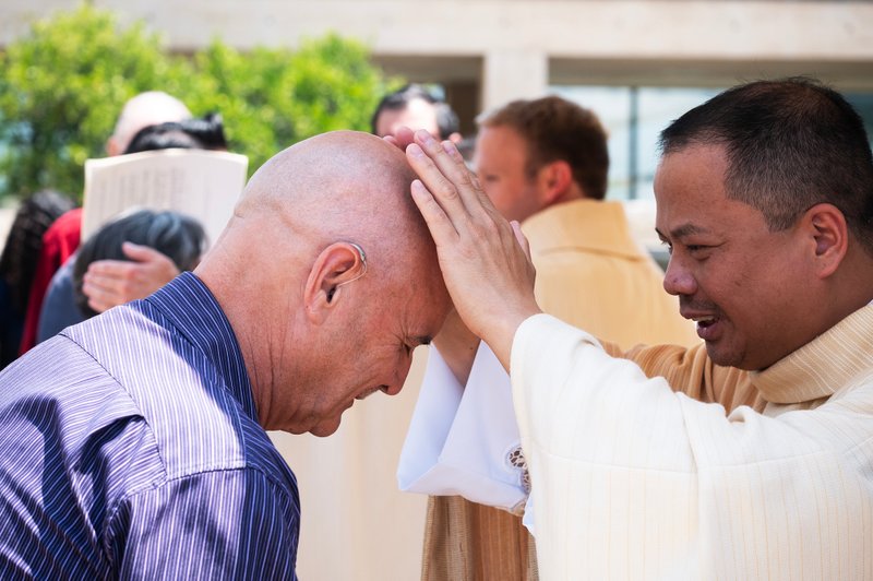 Father Allan Carodan blesses supporters following the new priests ordination Mass on May 31.(Victor Alemán)