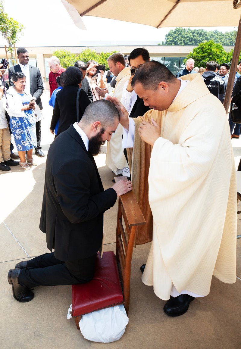 Father Allan Carodan blesses supporters following the new priests ordination Mass on May 31.(Victor Alemán)