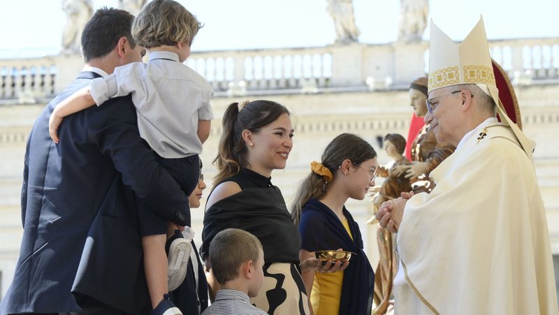A family presents the offertory gifts to Pope Leo XIV during Mass marking the Jubilee of Families, Children, Grandparents and the Elderly in St. Peter’s Square at the Vatican June 1, 2025. (CNS photo/Vatican Media)