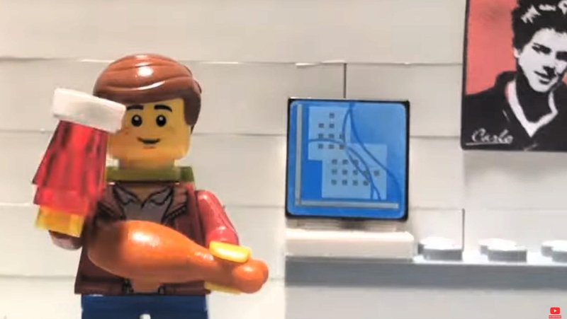 Blessed Carlo Acutis stands near his computer in a scene from a stop-motion animation Lego-Carlo Acutis film made by three brothers in County Limerick, Ireland, and released in mind-May 2025 on their YouTube channel, Fiontar Floinn. To the right in the background is a photo of Carlo (1996-2006). (OSV News photo/courtesy Flynn family)