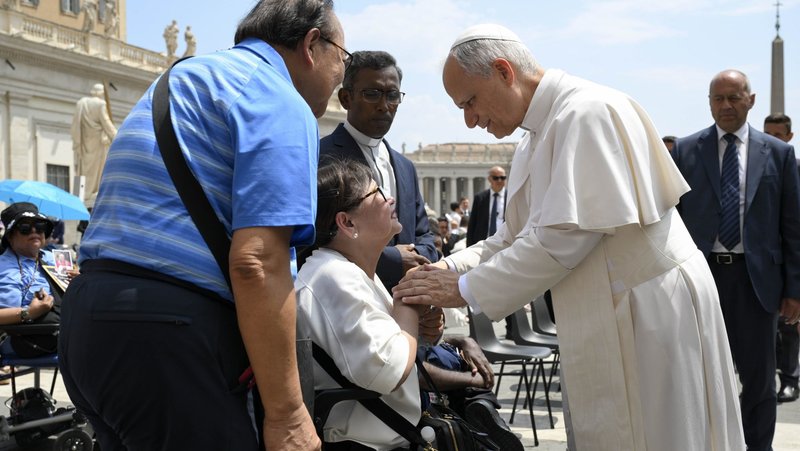 Pope Leo XIV blesses a woman in St. Peter's Square after his general audience at the Vatican June 18, 2025. (CNS photo/Vatican Media)