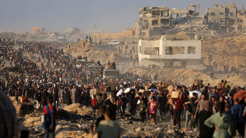 Palestinians gather to receive aid supplies in Beit Lahia, in the northern Gaza Strip, June 16, 2025, after being displaced by the Israeli military offensive. (OSV News photo/Dawoud Abu Alkas, Reuters)