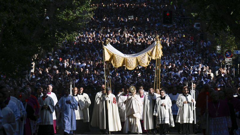 Sunlight shines on Pope Leo XIV as he carries a monstrance with the Blessed Sacrament in a Corpus Christi procession from Rome's Basilica of St. John Lateran to the Basilica of St. Mary Major June 22, 2025. (CNS photo/Vatican Media)