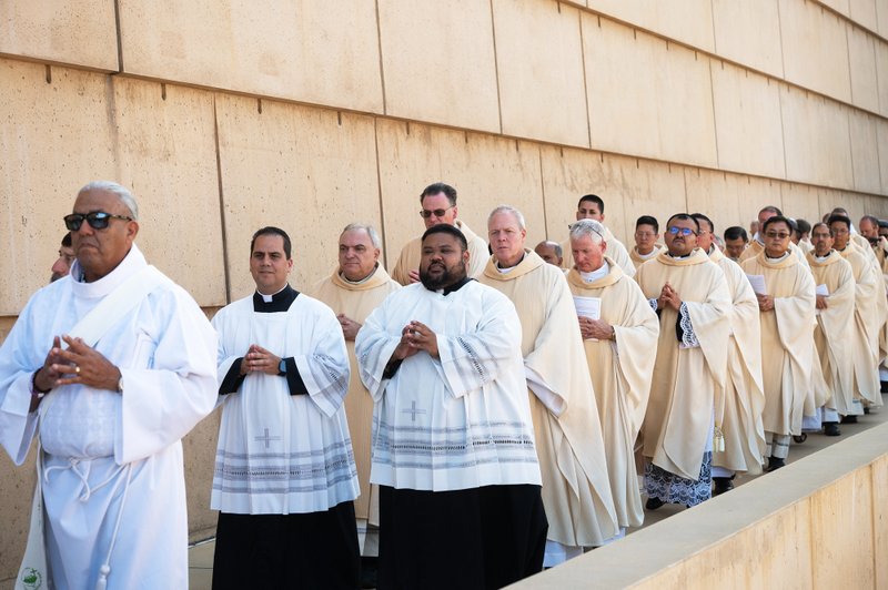 Dozens of priests process into the Cathedral of Our Lady of the Angels on June 22 for Mass during the National Eucharistic Pilgrimage. ((Victor Alemán)