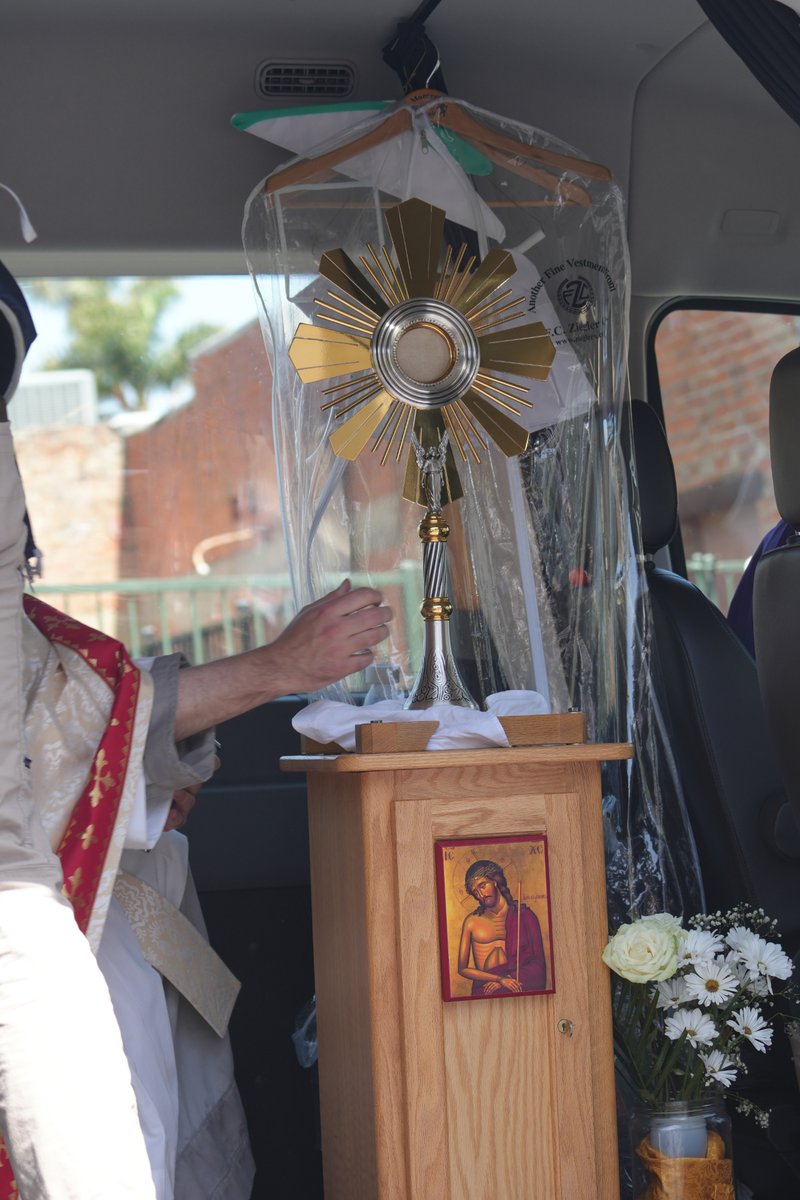Bishop Sławomir Szkredka carries the Blessed Sacrament back to the National Eucharistic Pilgrimage’s van after Mass on June 20. (Katie Trejo)