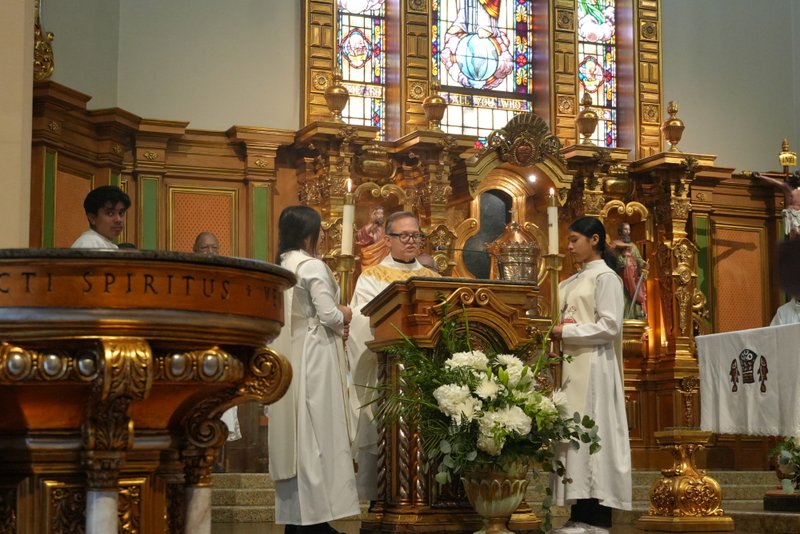 Father Gilbert Guzmán, pastor at Sacred Heart Church in Altadena, reads the Gospel during Mass on June 20, 2025, during the National Eucharistic Pilgrimage. (Katie Trejo)