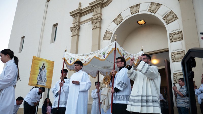 Archbishop José H. Gomez exits Sacred Heart Church with the monstrance holding the Holy Eucharist to begin a procession through the streets of Altadena as part of the National Eucharistic Pilgrimage on June 20. (Katie Trejo)