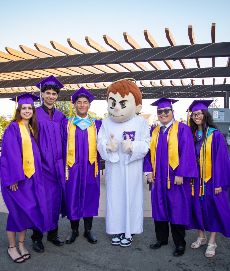 Graduates at St. Anthony High School in Long Beach with their Saints mascot during their graduation ceremony on June 5. (St. Anthony High School)
