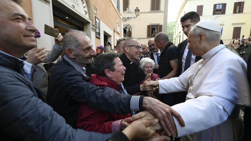 Pope Leo XIV greets people outside the Shrine of Our Lady of Good Counsel in Genazzano, Italy, southeast of Rome, May 10, 2025. The shrine, with a famous image of Mary, is run by the pope's Augustinian confreres. (CNS photo/Vatican Media)