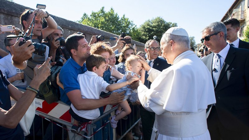 Pope Leo XIV greets children as he arrives in Castel Gandolfo, Italy, July 6, 2025, after reciting the Angelus at the Vatican. The pope will stay in Castel Gandolfo for his customary retreat through July 20. (CNS photo/Vatican Media)
