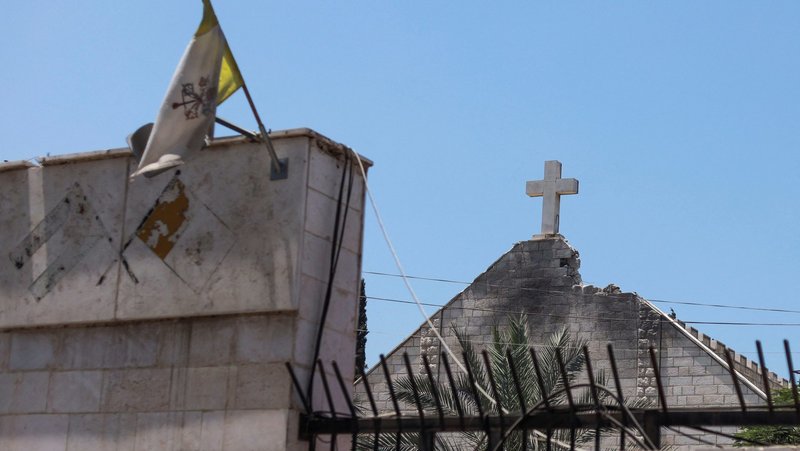 The Vatican City flag flies July 18, 2025, at Holy Family Church in Gaza City which was hit in an Israeli strike July 17. (OSV News photo/Khamis Al-Rifi, Reuters)