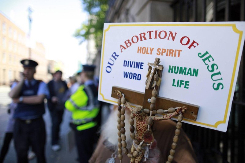 A file photo shows a sign with a crucifix and rosary during a pro-life demonstration outside the Irish Parliament in Dublin. Statistics released by the Department of Health in Ireland showed that abortions in Ireland spiked in the space of just five years. (OSV News/Cathal McNaughton, Reuters)