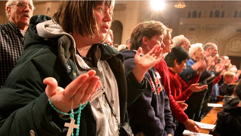 Catholics pray the Our Father during the vigil Mass opening the National Prayer Vigil for Life at the Basilica of the National Shrine of the Immaculate Conception in Washington, D.C., in this 2005 file photo. (CNS/Nancy Wiechec)