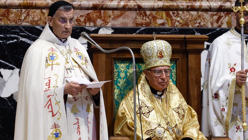 Cardinal Béchara Raï, patriarch of the Maronite Catholic Church, gives his homily as Melkite Catholic Patriarch Joseph Absi sits quietly during the celebration of a Byzantine Divine Liturgy as part of the assembly of the Synod of Bishops at the Altar of the Chair in St. Peter's Basilica at the Vatican Oct. 9, 2023. (CNS photo/Lola Gomez)