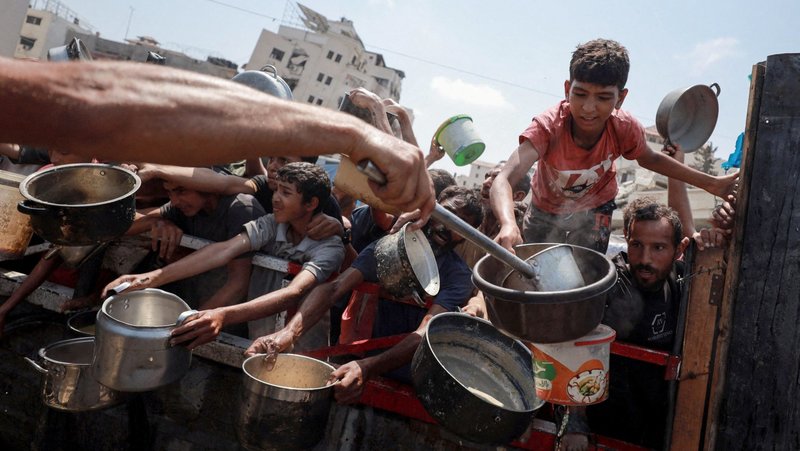 Palestinians gather to receive food from a charity kitchen amid a hunger crisis in the central Gaza Strip July 29, 2025. Despite daunting odds, Catholic Relief Services and its on-the-ground partners have managed to deliver aid to 1.7 million people in Gaza since 2023, according to new data. (OSV News photo/Hatem Khaled, Reuters)