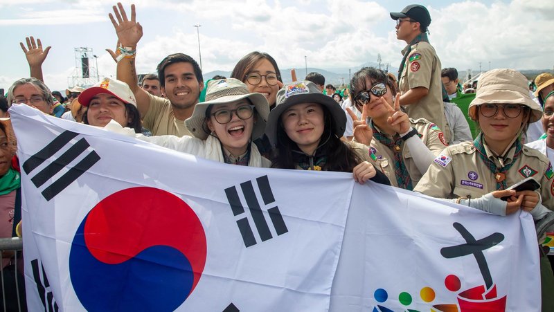 Pilgrims from South Korea wave flags and cheer as they participate in a Mass closing the Jubilee of Youth in Rome’s Tor Vergata neighborhood Aug. 3, 2025. (CNS/Pablo Esparza)