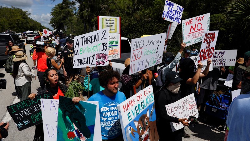 Protesters flank an entrance road at a temporary migrant detention center nicknamed "Alligator Alcatraz" in Ochopee, Fla., July 1, 2025, the day U.S. President Donald Trump visited the facility. (OSV News photo/Octavio Jones, Reuters)