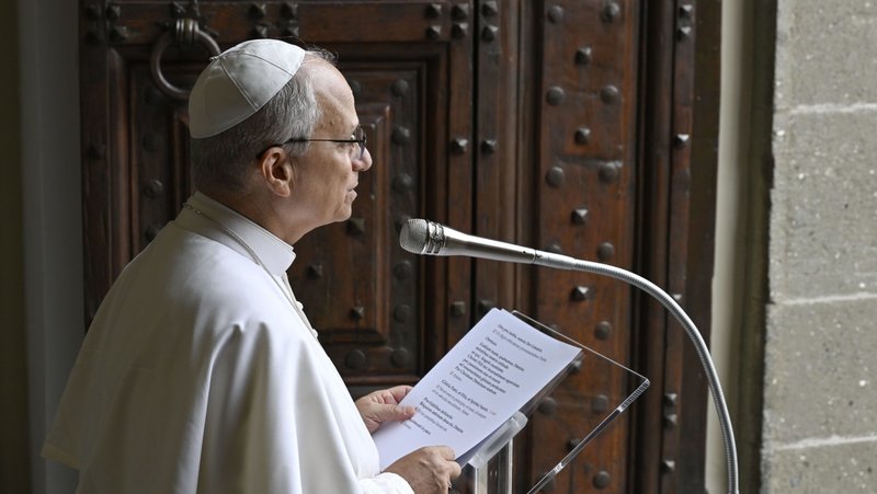Pope Leo XIV leads the recitation of the Angelus prayer in front of the papal palace in Castel Gandolfo, Italy, Aug. 17, 2025. (CNS/Vatican Media)