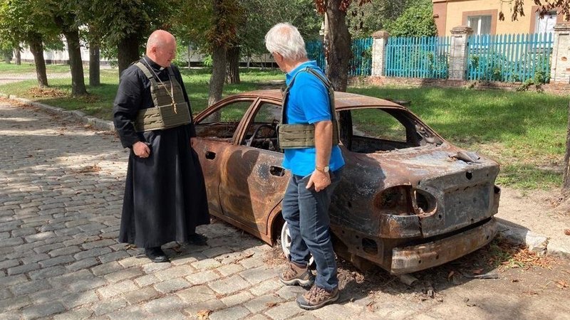 Auxiliary Bishop Jan Sobilo of Kharkiv-Zaporizhia, Ukraine, looks at a destroyed vehicle in in the summer of 2022 in the eastern Ukrainian region covered by the diocese. (OSV News photo/courtesy Bishop Sobilo)