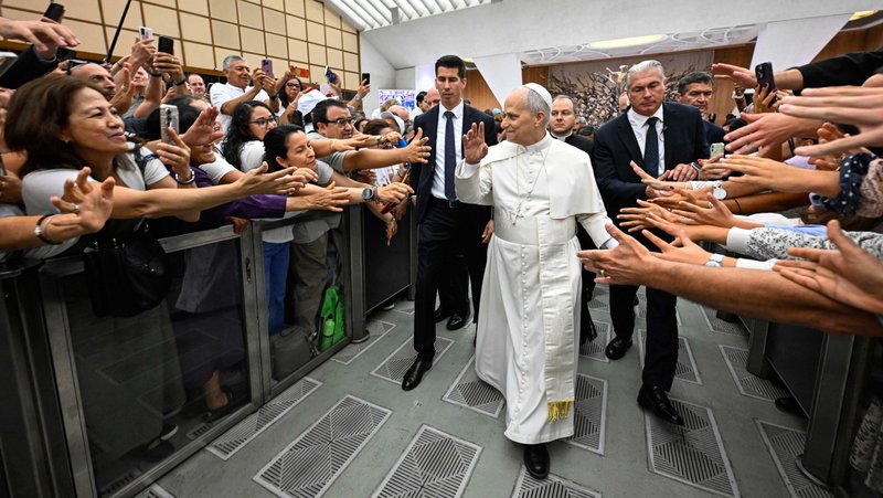 Pope Leo XIV greets people as he leaves the Paul VI Audience Hall at the Vatican after his weekly general audience Aug. 27, 2025. (CNS photo/Vatican Media)