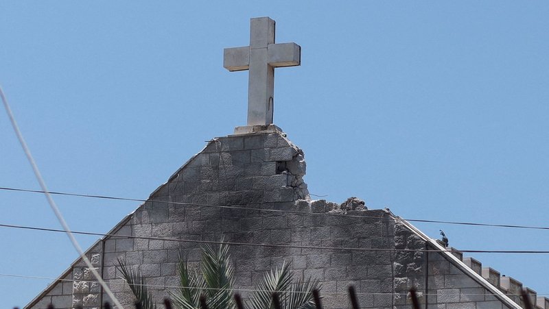 Burn marks can be seen below a cross atop Holy Family Church in Gaza City July 18, 2025, which was hit in an Israeli strike the previous day. (OSV News photo/Khamis Al-Rifi, Reuters)