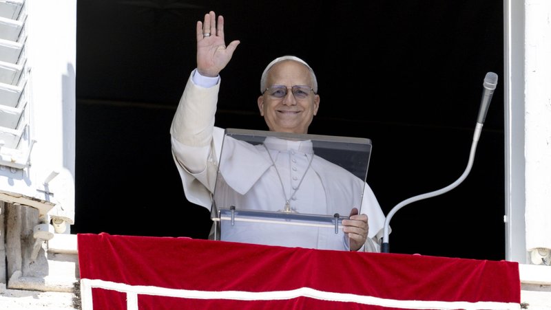Pope Leo XIV waves to visitors and pilgrims in St. Peter's Square at the Vatican Aug. 31, 2025, before leading the recitation of the Angelus prayer. (CNS photo/Vatican Media)