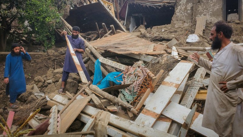 Afghan men search for their belongings amidst the rubble of a collapsed house after a deadly 6.0 magnitude earthquake struck Afghanistan around midnight, in Dara Mazar, in Kunar province, Afghanistan, Sept. 1, 2025. (OSV News/Reuters)