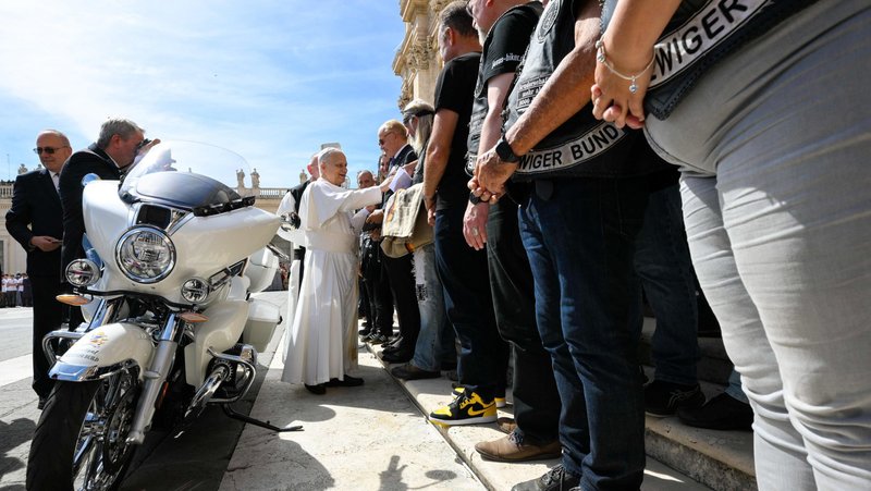 Pope Leo XIV greets members of the Jesus Bikers motorcycle club from Germany before autographing a modified BMW R18 motorcycle they presented with representatives of Missio Austria in St. Peter’s Square at the Vatican Sept. 3, 2025. The motorcycle will be auctioned by Sotheby’s, and proceeds will help Missio Austria build a school for children who work in the mica mines in Madagascar. (CNS photo/Vatican Media)