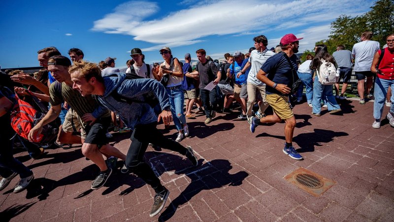 People run after a shot was fired at U.S. right-wing activist and commentator Charlie Kirk during a Utah Valley University speaking event in Orem, Utah, Sept. 10, 2025. (OSV News photo/Trent Nelson, The Salt Lake Tribune via Reuters)