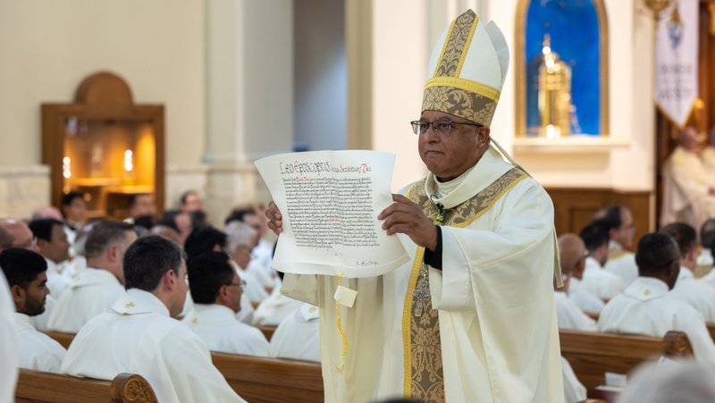 Bishop Daniel E. Garcia, Central Texas born and raised, displays the papal bull during his installation Mass as the new head of the Diocese of Austin, Texas, at St. William Catholic Church in Round Rock Sept. 18, 2025. (OSV News photo/Aaron Smith, courtesy Diocese of Austin)