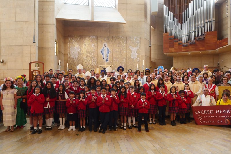 Archbishop José H. Gomez poses with attendees following the “One Mother, Many Peoples” Mass at the Cathedral of Our Lady of the Angels on Sept. 6, which celebrated the diverse cultures, organizations, and ethnic ministries in the Archdiocese of Los Angeles. (Reese Cuevas/Archdiocese of Los Angeles)