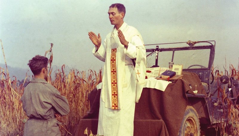 Father Emil Joseph Kapaun, a U.S. Army chaplain, celebrates Mass from the hood of a jeep Oct. 7, 1950, in South Korea. (OSV News/courtesy U.S. Army medic Raymond Skeehan)