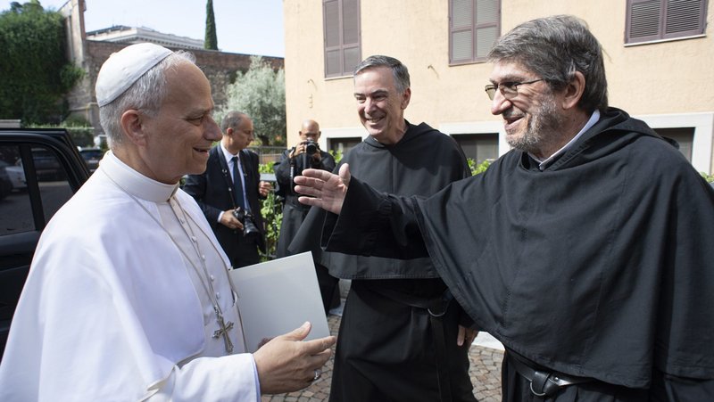 Pope Leo XIV greets Augustinian Father Alejandro Moral Antón, who recently completed his second term as prior general of the order, during a visit Sept. 15, 2025, to the Augustinianum Patristic Institute in Rome to meet with members of the Augustinian general chapter. (CNS photo/Vatican Media)