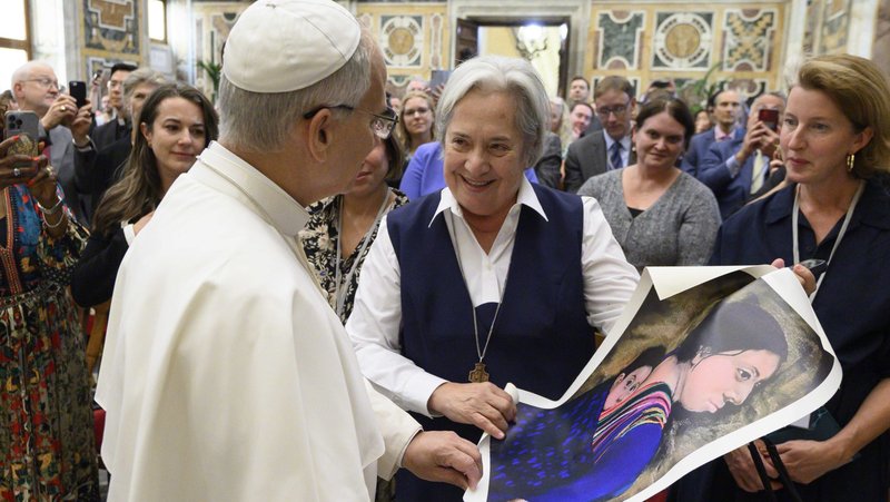 Pope Leo XIV receives a painting from Sister Norma Pimentel, an artist, a Missionary of Jesus and executive director of Catholic Charities of the Rio Grande Valley in Brownsville, Texas, during an audience at the Vatican Oct. 2, 2025. (CNS photo/Vatican Media)